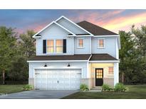 Charming two-story home showcasing a well-manicured lawn and attached two-car garage at 441 Providence Springs Ln, Fuquay Varina, NC 27526