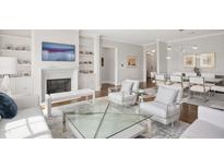Bright and spacious living room with fireplace, built-ins, stylish decor, and lots of natural light at 620 Wade Ave # 506, Raleigh, NC 27605