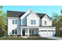 Charming two-story home with white siding, black roof, and well-manicured lawn at 94 Surles Landing Way, Benson, NC 27504