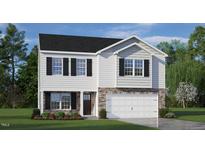 Charming two-story home with a stone and siding exterior, complemented by a well-manicured lawn and black window shutters at 1104 Ursa Major Ct, Wendell, NC 27591