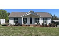Charming single-story home featuring a cozy front porch and well-maintained lawn at 1721 Daniels Farm Rd, Mebane, NC 27302