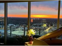 Enjoy breathtaking sunset views from this luxurious condo featuring floor-to-ceiling windows and stylish decor at 110 N Corcoran St # 2502, Durham, NC 27701