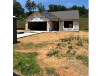 Image of home under construction showing framing, and the garage on a sunny day at 12 Crow Field St, Roxboro, NC 27574