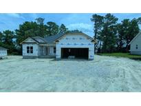 New construction home featuring an attached garage and covered entry awaiting personalization at 1547 Pecan Drive # 31, Nashville, NC 27856