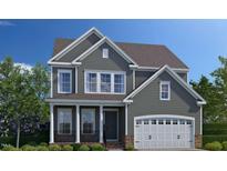 Charming two-story home with gray siding, white trim, and an inviting front porch at 3162 Armeria Dr, Apex, NC 27502
