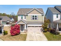 Charming two-story home with a landscaped front yard and neutral color palette at 36 Labradoodle Ct, Garner, NC 27529