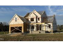 New home under construction, featuring wood framing and a two-car garage at 85 Prency Ln, Middlesex, NC 27557