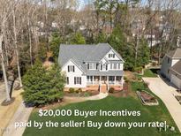 Charming two-story home with a welcoming front porch and well-maintained landscaping at 2021 Terri Creek Dr, Fuquay Varina, NC 27526