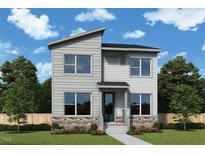 Charming two-story home with stone accents, a modern design, and well-manicured landscaping at 307 Parkland Dr, Pittsboro, NC 27312
