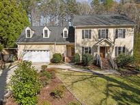Traditional two-story home with a two-car garage, dormer windows and a well manicured lawn at 5122 Berkeley St, Raleigh, NC 27612