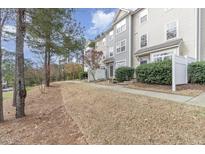 Charming townhomes with well-maintained landscaping and inviting entrances at 1311 Canyon Rock Ct # 105, Raleigh, NC 27610