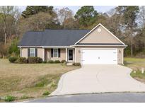 Charming single-story home featuring a well-maintained lawn and a two-car garage at 151 Goose Creek Cir, Dunn, NC 28334