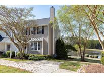 Charming townhome with well-manicured lawn and lake views at 200 Nottinghill Walk, Apex, NC 27502
