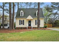 Charming two-story home with a well-maintained lawn and inviting front entrance at 204 Arnold Ln, Fuquay Varina, NC 27526