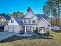 Charming two-story home with a three-car garage and a landscaped front yard at 286 Sea Mist Dr, Sanford, NC 27332