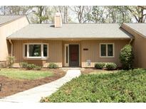 Charming home featuring a neutral exterior, manicured landscaping, and a welcoming front entrance at 716 Red Forest Trl, Raleigh, NC 27615