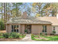 Charming one-story home featuring mature landscaping and a welcoming front entrance at 108 Beaver Dam Ct, Chapel Hill, NC 27514