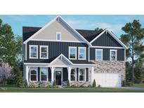Beautiful two-story home featuring a two-car garage and a combination of stone and siding accents at 213 Umstead St, Sanford, NC 27330