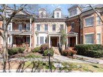 Charming brick townhome with well-manicured landscaping and inviting front entrance at 225 Oval Park Pl, Chapel Hill, NC 27517