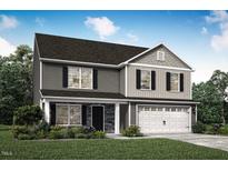 Charming two-story home featuring a gray exterior, black shutters, and a two-car garage at 290 Shiloh Way, Mebane, NC 27302