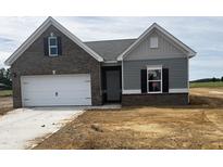 Charming single-Gathering home with a two-car garage and mixed brick and siding exterior at 34 E American Marigold Dr # 64, Benson, NC 27504