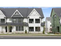 New townhouse showcases a modern exterior design with gray and white finishes and professional landscaping at 364 Church St, Morrisville, NC 27560