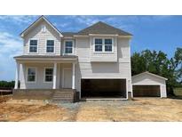 New two-story home with an attached two car garage and detached single car garage at 39 Atherton Circle, Angier, NC 27501