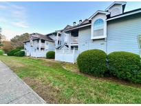 Charming condos feature manicured lawns, complemented by lush shrubbery and white picket fences at 4907 Hollenden Dr # 105, Raleigh, NC 27616