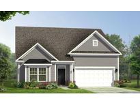 Charming single-story home features a modern exterior, attached garage, and well-maintained landscaping at 771 Old Station Pointe, Angier, NC 27501