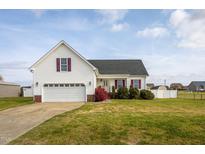 Charming single-Gathering home with a two-car garage, well-maintained lawn, and inviting curb appeal at 114 Hudson Dr, Princeton, NC 27569