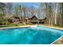 Inviting backyard pool and patio area, perfect for outdoor entertaining and relaxation at 136 Carolina Forest Rd, Chapel Hill, NC 27516