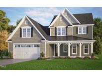 Two-story home features a two-car garage, gray siding, black shutters, and a covered porch at 158 W Victoria Ridge Dr # 23, Selma, NC 27576