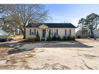 Charming one-story home with a cozy front porch and landscaped yard at 227 Coley Farm Rd, Fuquay Varina, NC 27526
