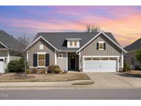 Charming single-Gathering home with a gabled roof, dormer, two-car garage, and well-maintained landscaping at 473 Abercorn Cir, Chapel Hill, NC 27516