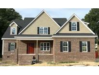 Charming brick home featuring a classic design with a red front door and black shutters at 801 Emmett Ct, Spring Hope, NC 27882