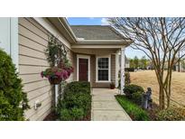 Inviting home entrance with flower baskets and well-maintained landscaping at 1404 Palmer Hill Dr, Durham, NC 27703