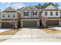 Charming townhome with a brick-accented facade and a well-maintained front yard in a desirable neighborhood at 150 Alamosa Pl, Cary, NC 27519