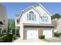 Charming two-story home features a two-car garage and classic architectural details at 2133 Persimmon Ridge Dr, Raleigh, NC 27604
