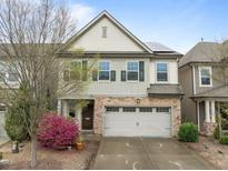 Charming two-story home with stone accents, a two-car garage, and a well-manicured front yard at 219 Begen St, Morrisville, NC 27560
