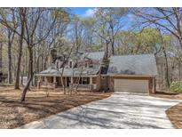 Charming brick home with attached garage and welcoming front porch at 1133 Turner Farms Rd, Garner, NC 27529