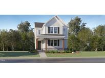 Charming two-story home with front porch and well-maintained landscaping in a desirable neighborhood at 316 Canyon Spring Trl, Wake Forest, NC 27587