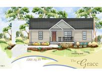 Charming single-story home featuring a welcoming front porch and well-manicured landscaping at 129 Grace Pond Ave, Benson, NC 27504