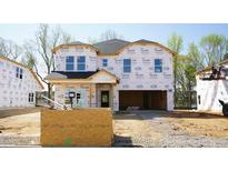 Exterior shot of a new build home with Tyvek wrap during construction at 3849 Rosebush Dr, Zebulon, NC 27597