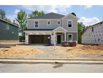 Two-story home with attached two-car garage in the process of being built at 3857 Rosebush Dr, Zebulon, NC 27597