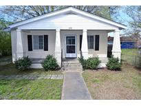 Charming single-story home with inviting front porch, well-maintained landscaping and visible house number at 428 Matthews St, Rocky Mount, NC 27801