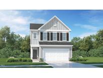 Charming two-story home with vertical siding, black shutters, and an attached two-car garage at 1011 Red Roses Ave, Durham, NC 27703