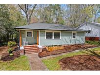Charming single-story home featuring a covered front porch and well-maintained landscaping at 304 W Maynard Ave, Durham, NC 27704