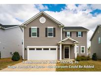 Two-story home with gray siding, black shutters, and a two-car garage, providing classic curb appeal at 112 Willow Grove Ln, Fuquay Varina, NC 27526