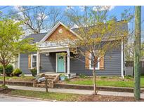 Charming two-story home with gray siding, wooden shutters, and a quaint porch at 208 S Guthrie Ave, Durham, NC 27703