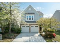 Charming two-story home featuring a stone and siding exterior with a two-car garage at 3011 September Dr, Durham, NC 27703